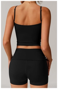 Rear view of black eco-friendly racerback yoga crop top and high-waist sports shorts
