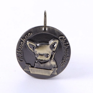 Macro shot of bronze Chihuahua pet ID tag with embossed dog breed design and custom area