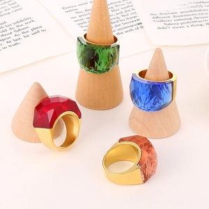 Set of four luxury vintage titanium steel rings with emerald, blue, red and amber crystals