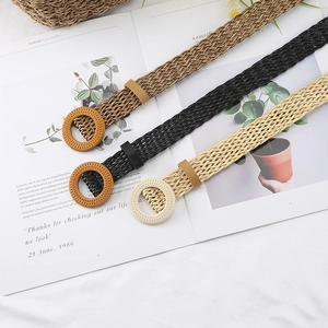 Women's woven waist belts with round buckles in brown black and beige colors