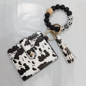 Black and white cow print silicone bead bracelet keychain with PU tassel card holder set