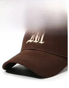 Detailed view of the dark brown cotton baseball cap with white embroidered 3D letter H