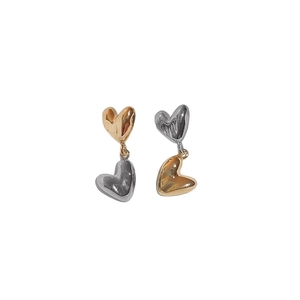 Elegant two-tone heart dangle earrings in polished gold and silver metallic finish