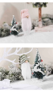 Detailed view of pink and striped knitted Christmas gnomes hanging on a decorated tree