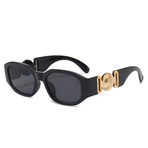 Retro small frame sunglasses in black with wide temples and golden relief decoration