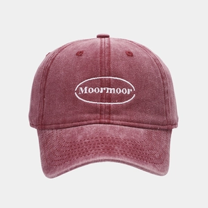 Detail of vintage washed wine red cotton baseball cap with Moormoor embroidery