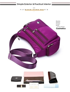 Detailed view of purple waterproof oxford bag showing multi-pocket storage capacity