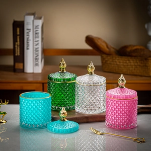Macro detail of diamond-cut texture on glass storage jars with elegant gold lids