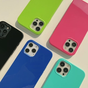 Vibrant silicone cases in neon green, pink, and blue with raised camera protection