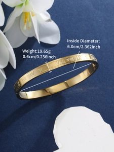 Detail showing dimensions of gold Roman numeral bangle with 6cm inner diameter