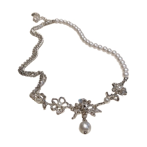 Elegant pearl necklace with silver metal chain and vintage hollow floral charms