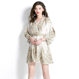 Beige paisley V-neck mini dress with lantern sleeves and a cinched waist for spring vacation