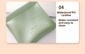 Detail of waterproof green PU leather makeup pouch with smooth fine texture