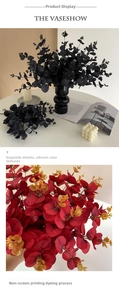 Detail of artificial black and burgundy eucalyptus leaves in a modern ceramic vase decor
