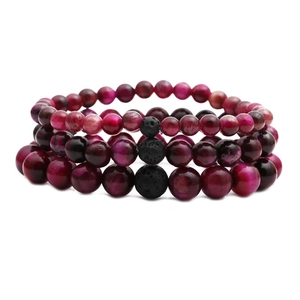 Three-piece beaded bracelet set with fuchsia tiger eye stones and black volcanic lava beads