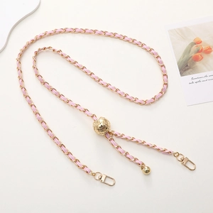 Pink leather woven with gold metal chain featuring a sphere adjustment buckle