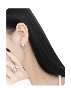 Detail of silver lava style studs with pearl and matching double layer rope ring