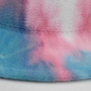 Detailed close-up of double-stitched brim on tie-dye wool felt fedora with pastel colors