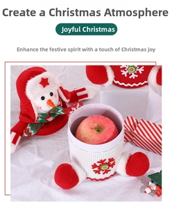 Detailed view of a knitted Christmas snowman candy jar with red snowflake patterns