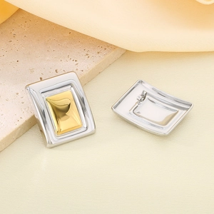 Detail view of rectangular two-tone 18K gold plated stainless steel geometric earrings