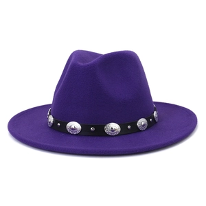 Detail of a purple wool fedora hat featuring a black faux leather band with silver studs
