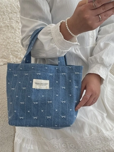 Denim tote bag with white bow embroidery and heart patterns for daily casual use