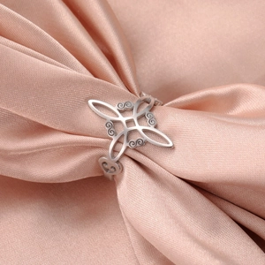 Macro detail of silver stainless steel ring with Celtic knot and heart engraving