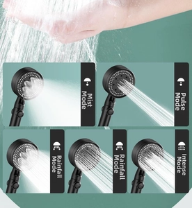 Detail of black matte booster shower head showing five different spray modes and hand test