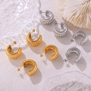 Textured C-shape titanium steel earrings in gold and silver finish for a modern look
