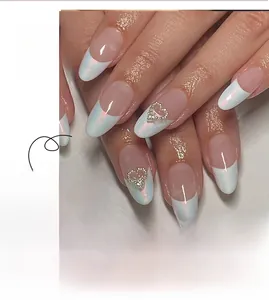 Close-up of white French press-on nails featuring 3D silver heart rhinestones and glitter