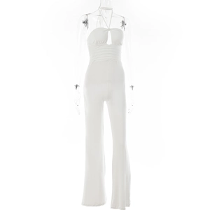 Detail of white halter neck jumpsuit featuring central cutout and wide leg silhouette