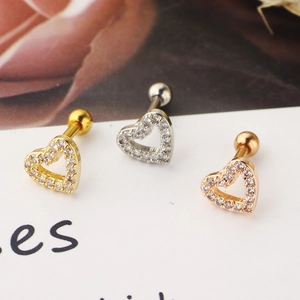 Detailed view of heart-shaped cartilage tragus earrings with zircon in gold, silver, and rose gold