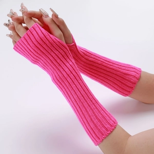 Detail of neon pink ribbed knit arm warmers showing thumb hole and long sleeve fit