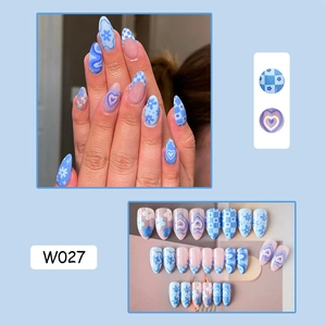Detail of almond-shaped blue and pink floral press-on nails set including model W027 close-up