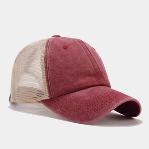 Detail view of burgundy cotton and cream mesh trucker hat with contrast stitching