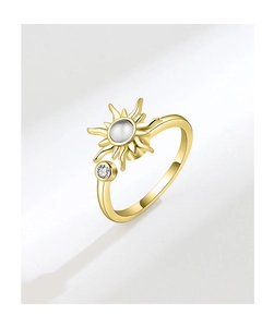 Detail view of rotating sunflower ring with cream gemstone and gold polished finish