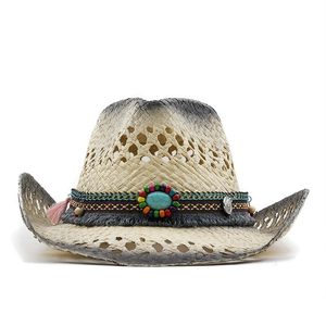 Straw cowboy hat with turquoise stone beads and colorful tassels on a white background
