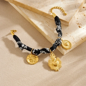 Vintage gold plated stainless steel fabric bracelet with floral heart and rose charms