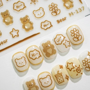 Bronzing nail stickers M-137 with brown bears, flowers and stars on white background