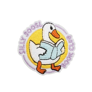 Silly Goose Book Club embroidered iron-on patch featuring a reading cartoon goose
