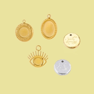 Golden and silver stainless steel jewelry pendants in round and oval shapes for DIY crafts