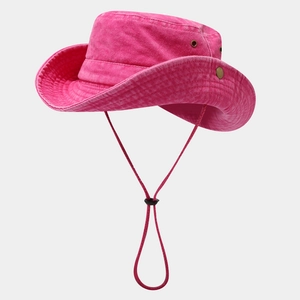 Macro detail of breathable metal eyelets and adjustable chin cord on pink outdoor hat