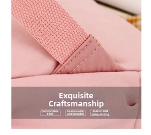 Close-up of pink backpack handle with reinforced stitching and twill nylon fabric detail
