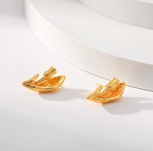 Bohemian 18K gold tulip bud stud earrings with brushed metal texture on white background