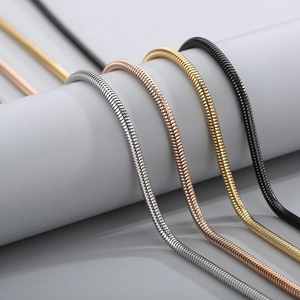 Sleek stainless steel snake bone chains in silver, rose gold, gold, and black finishes