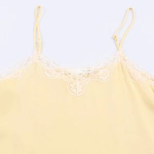 Women casual lace trim camisole top in light yellow with adjustable straps on white background