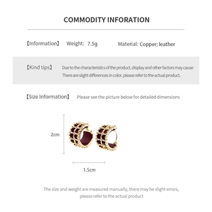 Detail view of 18K gold plated leather hoop earrings with 2cm height and 7.5g weight