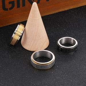 Religious stainless steel spinning rings with Padre Nuestro engraving and cross detail
