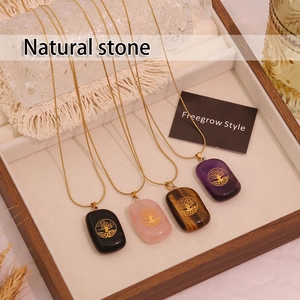 Natural stone tree of life necklaces in obsidian, rose quartz, tiger eye, and amethyst