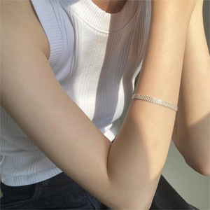 Detailed view of 925 sterling silver mesh woven bracelet on wrist with elegant texture